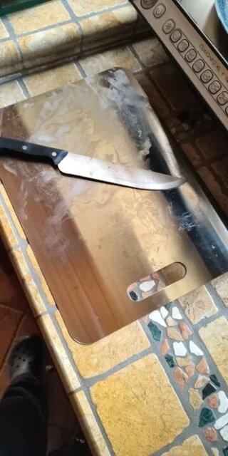 Planche à découper, en inox sain.