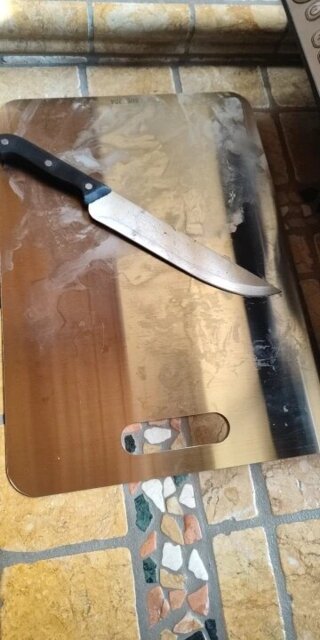 Planche à découper, en inox sain.